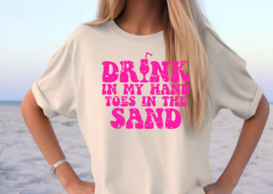 drink in my hand toes in the sand